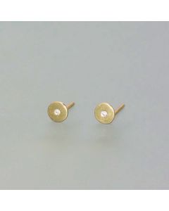 Delicate gold stud earrings with a small diamond