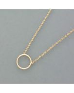 Delicate gold necklace with a circle pendant