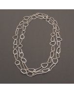 Long silver necklace with irregular shape links