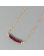 delicate necklace of gold with ruby