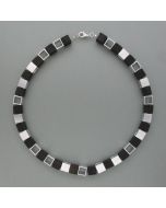 Necklace with cubes of ebony and nickel silver