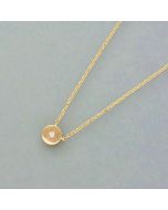 Delicate gold necklace with a small diamond pendant