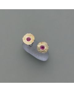 Blackened ear studs with ruby, patina