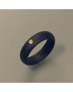 Ring made of carbon with brilliant