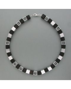 Necklace with cubes of ebony and nickel silver