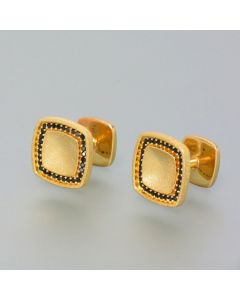 Cufflinks gilded with spinel